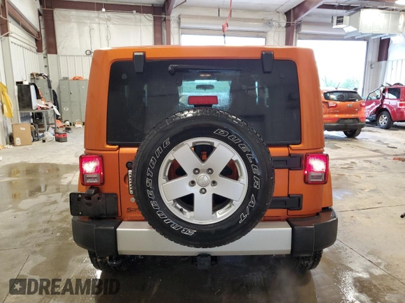 2011 Jeep Wrangler Sahara with VIN 1J4GA5D1XBL557392, listed as a Copart auction lot 56892835 with 109,567 mi miles and Clean title. Bid and sale history available at DreamBid. Image 6.