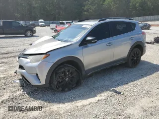 2018 Toyota RAV4 XLE with VIN 2T3WFREVXJW427748, listed as a Copart auction lot 61833055 with 104,057 mi miles and Salvage title. Bid and sale history available at DreamBid. Image 1.
