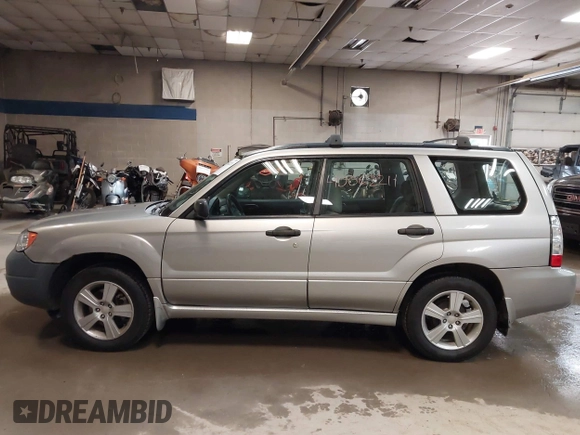 2006 Subaru Forester 2.5 X with VIN JF1SG636X6H712880, listed as a IAAI auction lot 40062211 with 127,537 mi miles. Bid and sale history available at carsss.com. Image 14.