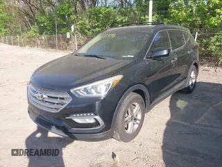 2017 Hyundai Santa Fe 2.4L z VIN 5NMZU3LB2HH037704, wystawiony jako IAAI lot #42113964 z przebiegiem 125 488 mil mil oraz . Historia ofert i sprzedaży dostępna na DreamBid. Obrazek 2.