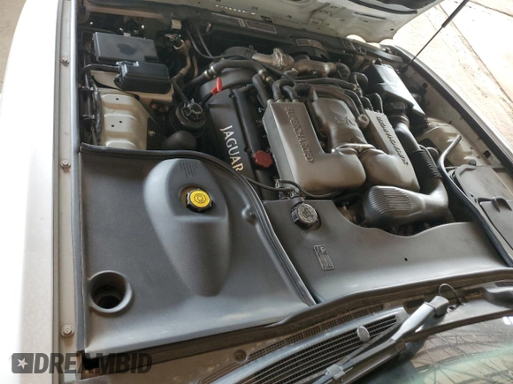 2000 Jaguar XJ with VIN SAJDA25B8YMF04079, listed as a Copart auction lot 50592595 with 131,647 mi miles and Salvage title. Bid and sale history available at DreamBid. Image 11.