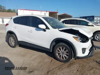 2014 Mazda CX-5 Touring with VIN JM3KE2CY8E0409322, listed as a IAAI auction lot 42174225 with 163,645 mi miles and . Bid and sale history available at DreamBid. Image 1.