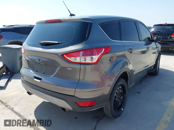 2014 Ford Escape SE with VIN 1FMCU0GX8EUD57801, listed as a IAAI auction lot 41856252 with 136,980 mi miles. Bid and sale history available at carsss.com. Image 4.