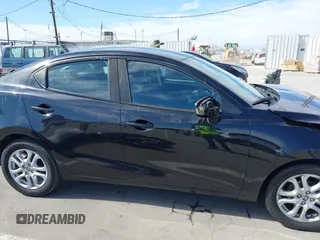 2016 Scion iA z VIN 3MYDLBZVXGY136298, wystawiony jako IAAI lot #42014712 z przebiegiem 124 038 mil mil oraz . Historia ofert i sprzedaży dostępna na DreamBid. Obrazek 14.