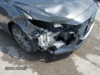 2018 Mazda 3 Touring z VIN 3MZBN1L35JM271525, wystawiony jako IAAI lot #42112552 z przebiegiem 107 299 mil mil oraz . Historia ofert i sprzedaży dostępna na DreamBid. Obrazek 6.