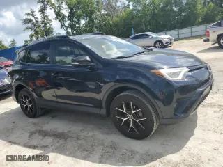 2018 Toyota RAV4 SE with VIN JTMJFREVXJD256779, listed as a Copart auction lot 52521195 with 100,453 mi miles and Salvage Title. Bid and sale history available at carsss.com. Image 4.