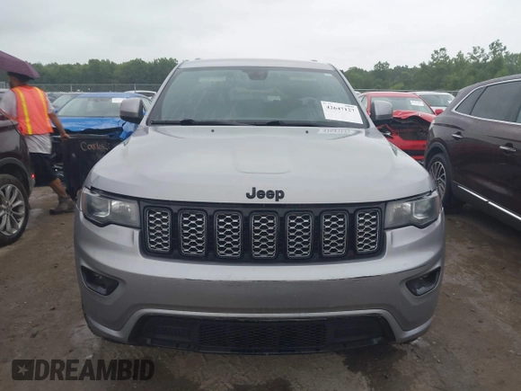 2018 Jeep Grand Cherokee Laredo E with VIN 1C4RJFAG6JC452859, listed as a IAAI auction lot 42647127 with 107,869 mi miles and . Bid and sale history available at DreamBid. Image 11.