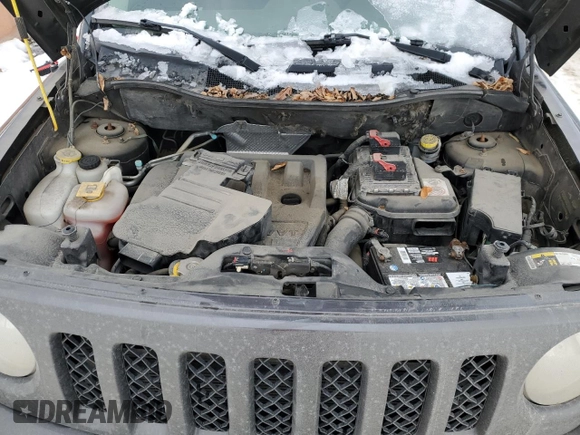 2015 Jeep Patriot North with VIN 1C4NJRAB7FD311725, listed as a Copart auction lot 82647074 with 185,560 mi miles and Salvage Title. Bid and sale history available at carsss.com. Image 12.