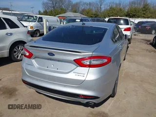 2014 Ford Fusion Titanium Hybrid with VIN 3FA6P0RU9ER147443, listed as a IAAI auction lot 41739540 with 146,359 mi miles. Bid and sale history available at carsss.com. Image 4.