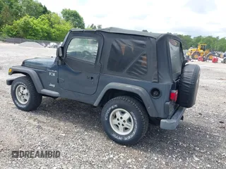2002 Jeep Wrangler X with VIN 1J4FA39S92P736825, listed as a IAAI auction lot 42156410 with 196,313 mi miles. Bid and sale history available at carsss.com. Image 3.