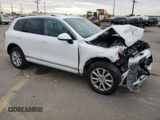 2014 Volkswagen Touareg Sport with VIN WVGEF9BP3ED005921, listed as a Copart auction lot 77372514 with 156,753 mi miles and Salvage Title. Bid and sale history available at DreamBid. Image 4.