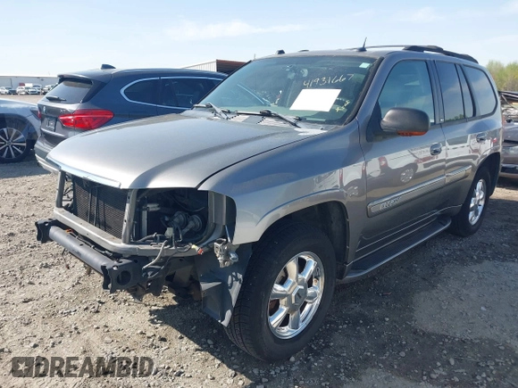 2005 GMC Envoy SLE with VIN 1GKDS13S452306939, listed as a IAAI auction lot 41931667 with 236,955 mi miles and . Bid and sale history available at DreamBid. Image 2.