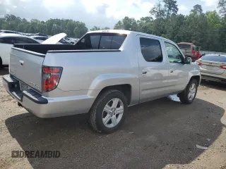 2014 Honda Ridgeline RTL with VIN 5FPYK1F58EB012869, listed as a Copart auction lot 51854995 with 318,950 mi miles and Salvage title. Bid and sale history available at DreamBid. Image 3.