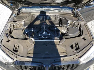 2018 BMW M5 z VIN WBSJF0C57JB283361, wystawiony jako Copart lot #65352164 z przebiegiem Nie podano mil oraz Szkoda całkowita • Salvage title. Historia ofert i sprzedaży dostępna na DreamBid. Obrazek 11.