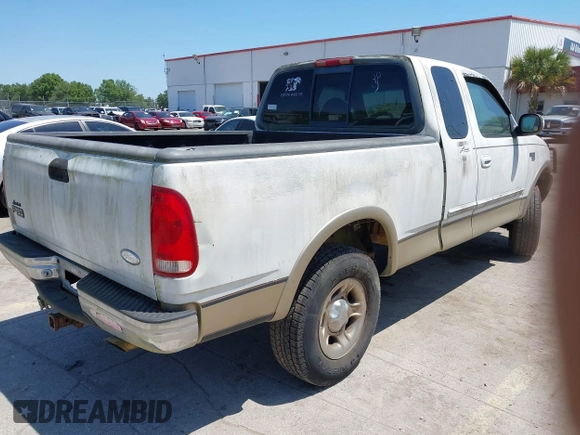 1999 Ford F-150 XL with VIN 2FTRX18L8XCB22793, listed as a IAAI auction lot 42016740 with 198,056 mi miles. Bid and sale history available at carsss.com. Image 4.