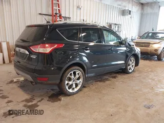 2016 Ford Escape Titanium with VIN 1FMCU0JX3GUB70607, listed as a IAAI auction lot 41727421 with 106,857 mi miles. Bid and sale history available at carsss.com. Image 4.