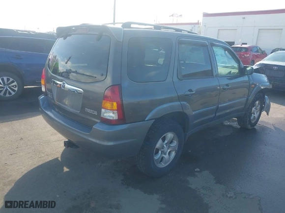 2002 Mazda Tribute LX with VIN 4F2YU08142KM18539, listed as a IAAI auction lot 41742104 with 230,254 mi miles. Bid and sale history available at carsss.com. Image 4.
