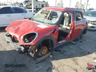 2014 MINI Countryman S with VIN WMWZC3C54EWP26355, listed as a IAAI auction lot 41654476 with Not Provided miles and . Bid and sale history available at DreamBid. Image 2.