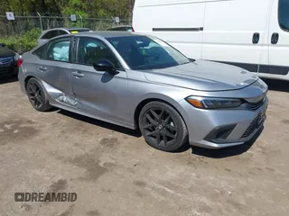 2023 Honda Civic Sport z VIN 2HGFE2F54PH523393, wystawiony jako IAAI lot #42056691 z przebiegiem 19 955 mil mil oraz . Historia ofert i sprzedaży dostępna na DreamBid. Obrazek 1.