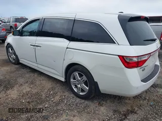 2012 Honda Odyssey Touring with VIN 5FNRL5H93CB034485, listed as a IAAI auction lot 42304502 with 198,589 mi miles and . Bid and sale history available at DreamBid. Image 3.