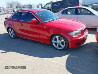 2011 BMW 1 Series 128i with VIN WBAUP7C57BVK78880, listed as a IAAI auction lot 41654648 with 136,898 mi miles. Bid and sale history available at carsss.com. Image 1.