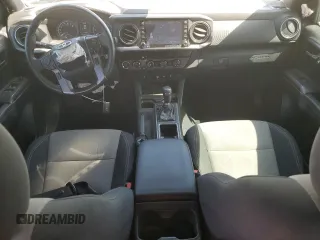 2020 Toyota Tacoma SR5 with VIN 3TMCZ5AN9LM296891, listed as a Copart auction lot 56047625 with 74,301 mi miles and Salvage title. Bid and sale history available at DreamBid. Image 8.