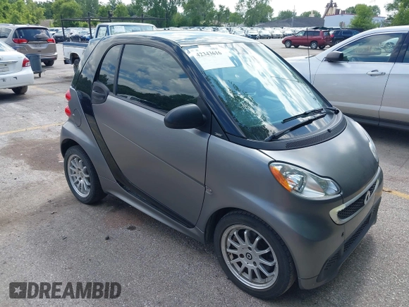 2013 Smart fortwo Pure with VIN WMEEJ3BA9DK585327, listed as a IAAI auction lot 42343616 with 101,194 mi miles and . Bid and sale history available at DreamBid. Image 1.