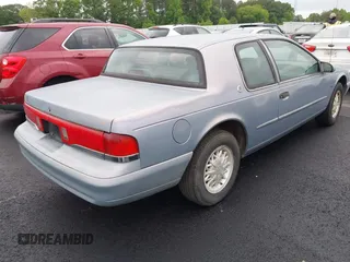 1995 Mercury Cougar z VIN 1MELM62W3SH600097, wystawiony jako IAAI lot #42185484 z przebiegiem 216 393 mil mil oraz . Historia ofert i sprzedaży dostępna na DreamBid. Obrazek 4.
