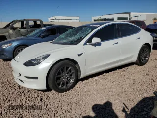 2020 Tesla Model 3 Standard Range Plus with VIN 5YJ3E1EA4LF799597, listed as a Copart auction lot 76401374 with 77,506 mi miles and Salvage Title. Bid and sale history available at DreamBid. Image 1.