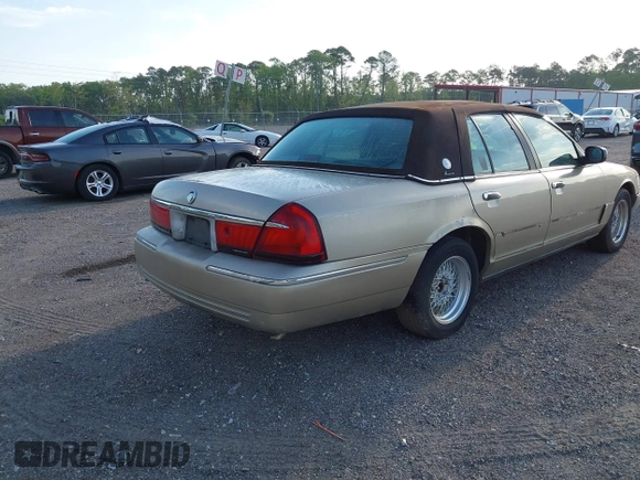 1999 Mercury Grand Marquis LS z VIN 2MEFM75W1XX703878, wystawiony jako IAAI lot #42074187 z przebiegiem 56 962 mil mil oraz . Historia ofert i sprzedaży dostępna na DreamBid. Obrazek 4.