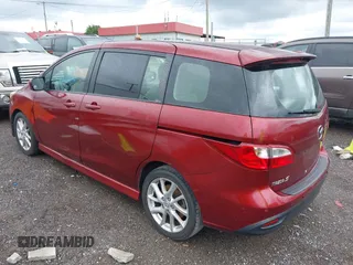 2012 Mazda 5 Grand Touring with VIN JM1CW2DLXC0134997, listed as a IAAI auction lot 42360574 with 230,951 mi miles and . Bid and sale history available at DreamBid. Image 3.