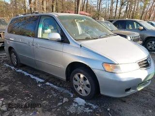 2004 Honda Odyssey EX-L with VIN 5FNRL18774B033414, listed as a IAAI auction lot 41393283 with 211,094 mi miles and . Bid and sale history available at DreamBid. Image 1.