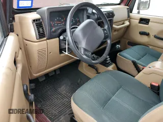 2002 Jeep Wrangler Sahara with VIN 1J4FA59S32P746410, listed as a Copart auction lot 56403075 with 147,968 mi miles and Salvage title. Bid and sale history available at DreamBid. Image 8.