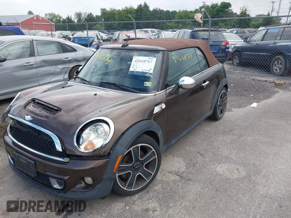 2011 MINI Convertible S with VIN WMWZP3C50BTX84044, listed as a IAAI auction lot 42669717 with Not provided miles and . Bid and sale history available at DreamBid. Image 2.