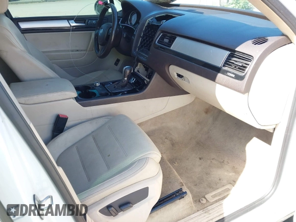 2012 Volkswagen Touareg Sport with VIN WVGEF9BP5CD007294, listed as a IAAI auction lot 41841268 with 160,883 mi miles and . Bid and sale history available at DreamBid. Image 5.