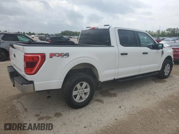 2022 Ford F-150 XL with VIN 1FTFW1E82NFA51713, listed as a Copart auction lot 54581755 with 69,966 mi miles and Salvage Title. Bid and sale history available at DreamBid. Image 3.