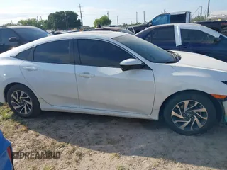 2018 Honda Civic EX with VIN 19XFC2F7XJE039026, listed as a IAAI auction lot 41963886 with 71,011 mi miles and . Bid and sale history available at DreamBid. Image 14.