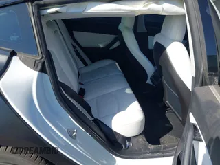 2019 Tesla Model 3 Mid Range with VIN 5YJ3E1EA0KF509547, listed as a IAAI auction lot 40720566 with 41,655 mi miles and . Bid and sale history available at DreamBid. Image 7.