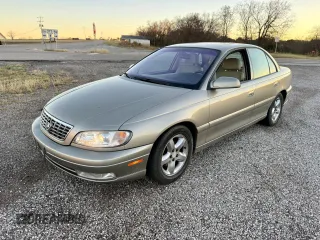 2001 Cadillac Catera z VIN W06VR54R01R009345, wystawiony jako Copart lot #80393534 z przebiegiem 43 757 mil mil oraz Tytuł czysty. Historia ofert i sprzedaży dostępna na DreamBid. Obrazek 2.