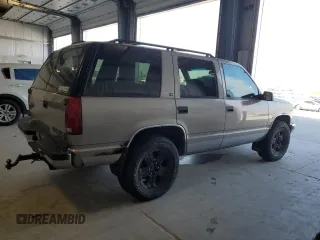 1999 Chevrolet Tahoe Z71 z VIN 1GNEK13R2XJ338897, wystawiony jako Copart lot #54219225 z przebiegiem 232 020 mil mil oraz Szkody całkowita. Historia ofert i sprzedaży dostępna na DreamBid. Obrazek 3.