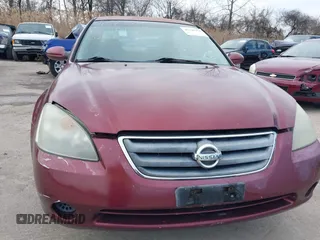2002 Nissan Altima S with VIN 1N4AL11DX2C216559, listed as a IAAI auction lot 41540001 with 112,084 mi miles. Bid and sale history available at carsss.com. Image 13.