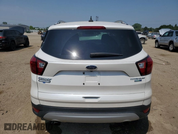 2019 Ford Escape Titanium z VIN 1FMCU9J93KUA51020, wystawiony jako Copart lot #60462495 z przebiegiem 59 998 mil mil oraz Szkoda całkowita • Salvage title. Historia ofert i sprzedaży dostępna na DreamBid. Obrazek 6.