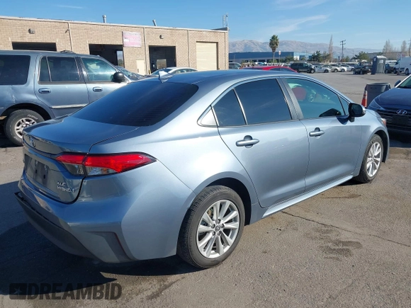 2023 Toyota Corolla Hybrid LE with VIN JTDBCMFEXP3006343, listed as a IAAI auction lot 41056503 with 121,690 mi miles. Bid and sale history available at carsss.com. Image 4.