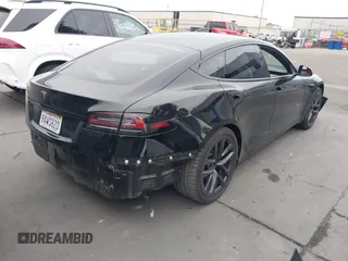 2022 Tesla Model S with VIN 5YJSA1E55NF474342, listed as a IAAI auction lot 41870994 with 33,804 mi miles and . Bid and sale history available at DreamBid. Image 4.