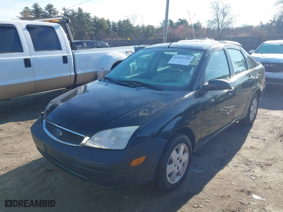 2007 Ford Focus S with VIN 1FAHP34N07W166828, listed as a IAAI auction lot 41992308 with 143,169 mi miles. Bid and sale history available at carsss.com. Image 2.