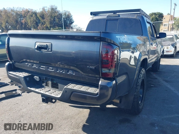2021 Toyota Tacoma 4WD SR5 with VIN 3TMDZ5BNXMM107525, listed as a IAAI auction lot 41062698 with 41,771 mi miles. Bid and sale history available at carsss.com. Image 4.