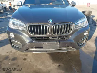 2019 BMW X6 sDrive35i with VIN 5UXKU0C57K0S97581, listed as a IAAI auction lot 41322568 with 76,635 mi miles. Bid and sale history available at carsss.com. Image 12.