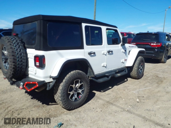 2023 Jeep Wrangler Rubicon with VIN 1C4HJXFG8PW655138, listed as a IAAI auction lot 41674959 with 40,790 mi miles and . Bid and sale history available at DreamBid. Image 4.