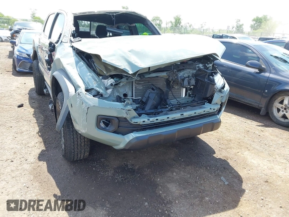 2023 Toyota Tacoma SR with VIN 3TMCZ5AN1PM581266, listed as a IAAI auction lot 42371395 with 32,582 mi miles and . Bid and sale history available at DreamBid. Image 6.
