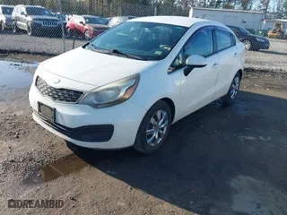 2013 Kia Rio LX with VIN KNADM4A37D6240703, listed as a IAAI auction lot 41938543 with 221,111 mi miles. Bid and sale history available at carsss.com. Image 2.